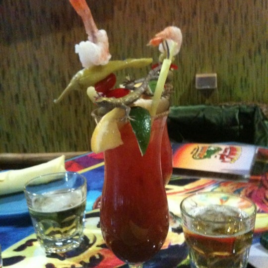 Photo taken at Jimmy&#39;s Island Grill &amp; Iguana Bar by Charity G. on 3/4/2012