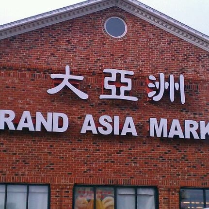 Photo taken at Grand Asia Market by Mark S. on 12/24/2011