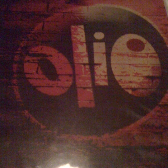 Photo taken at Olio Restaurante by Jennifer V. on 7/24/2011