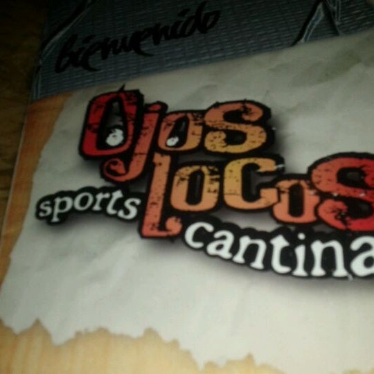 Photo taken at Ojos Locos Sports Cantina by Manuel A. on 1/22/2012