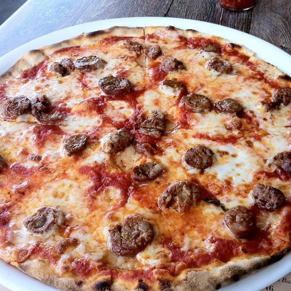 The spicy sausage on the La Diavola Pizza is made in-house and is quite tasty! If the weather is good, dine on the patio.