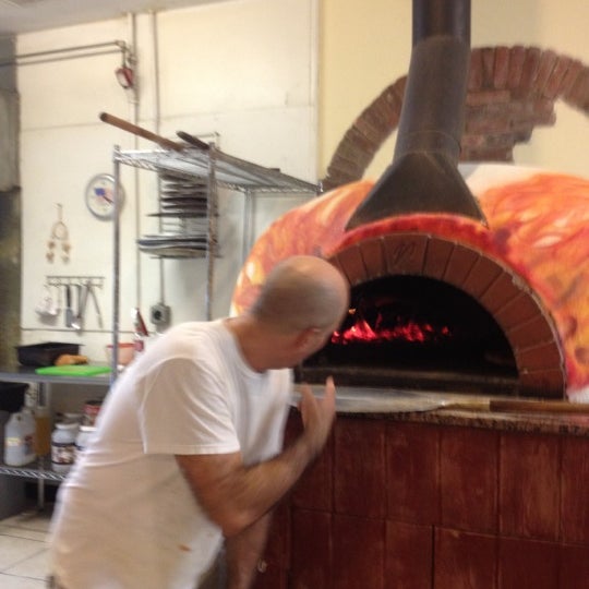 Photo taken at The Pizza Joint Wood Fire Pies by Kim D. on 4/24/2012