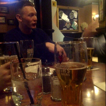 Photo taken at The OverDraught Irish Pub by Brittany Z. on 12/23/2011