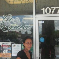 Photo taken at La Pergola Cafe by Mauricio G. on 9/23/2011