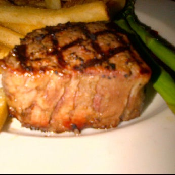 Photo taken at The Keg Steakhouse + Bar - Las Colinas by Joe C. on 4/19/2012