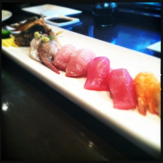 Photo taken at Okura Robata Sushi Bar and Grill by Lindsey G. on 5/6/2012