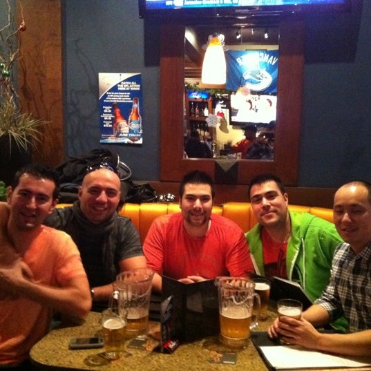 Photo taken at Wings Tap &amp; Grill by Emre K. on 11/27/2011
