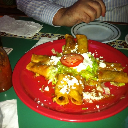 Photo taken at Cancún Family Mexican Restaurant by Helen D. on 9/12/2011