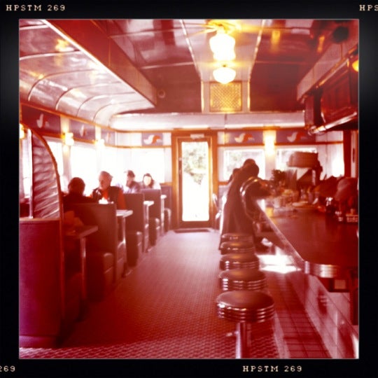 Photo taken at The Madison Diner by Julien G. on 12/30/2011