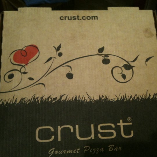 Photo taken at Crust Gourmet Pizza Bar by Jose on 6/28/2012