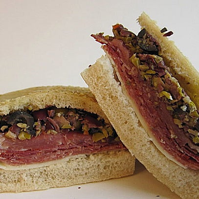 Imagine a thick, two-fisted Italian sandwich with provolone and imported cold cuts (capicola, prosciutto, soppressata) with a thick layer of chopped olive salad marinated with lemon zest and oil. Try!