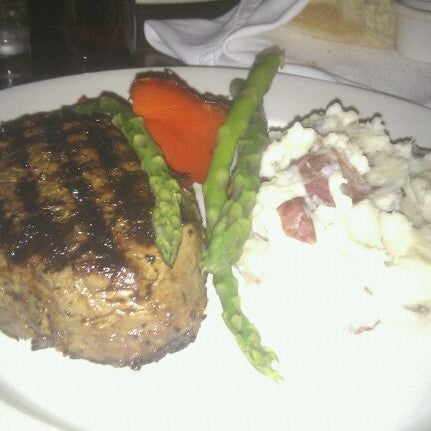 Photo taken at The Keg Steakhouse + Bar - Windsor Riverside by Gary M. on 3/30/2012