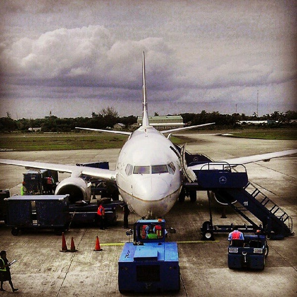 Photo taken at Philip S.W. Goldson International Airport (BZE) by JC C. on 6/23/2012