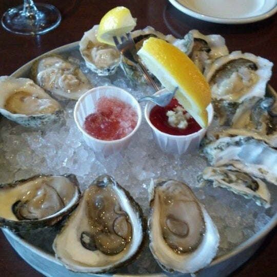 Photo taken at Molly Cool&#39;s Seafood Tavern by Andrea B. on 4/27/2012