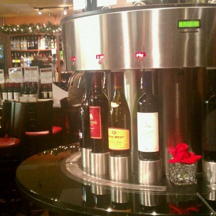 Photo taken at OC Wine Mart &amp; Tasting Bar by Oscar G. on 2/11/2012