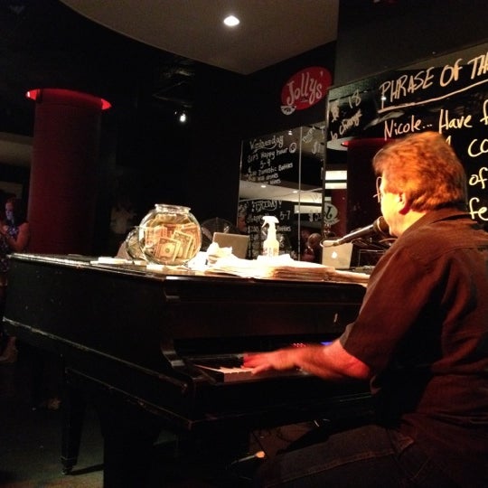 Photo taken at Jolly&#39;s American Beer Bar and Dueling Pianos by B.J. E. on 6/17/2012