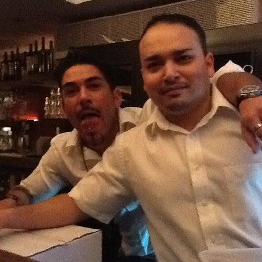 Photo taken at Barcelona Restaurant &amp; Wine Bar by Canaan F. on 2/11/2012