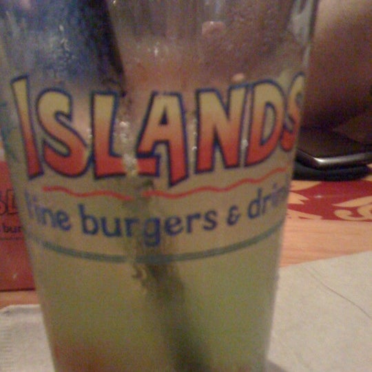 Photo taken at Islands Restaurant by celeste j. on 8/4/2011