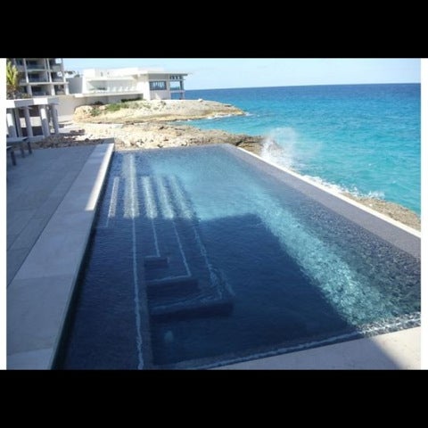 Photo taken at Four Seasons Resort and Residences Anguilla by Alex M. on 3/17/2011