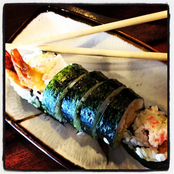 Photo taken at Aisuru Sushi + Sake Bar by Lisa-Marie J. on 4/2/2012