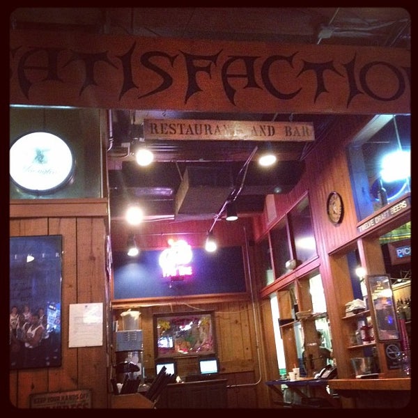 Photo taken at Satisfaction Restaurant &amp; Bar by Chris G. on 1/30/2012