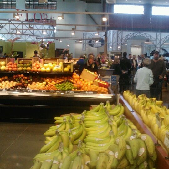Photo taken at Uptown Grocery Co. by V V. on 2/29/2012