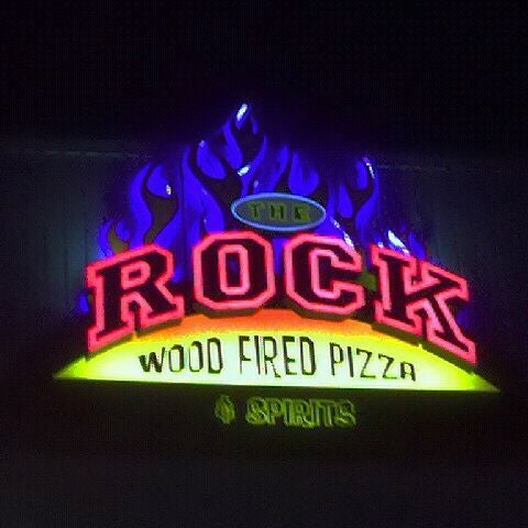 Photo taken at The Rock Wood Fired Pizza by Jennifer S. on 12/16/2011