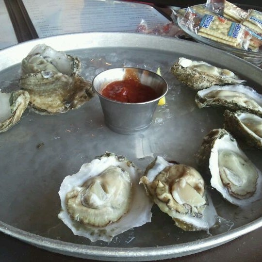 Photo taken at Mahi Mah&#39;s Seafood Restaurant by Tara R. on 5/28/2012