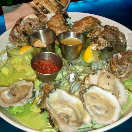Photo taken at Blu Que Island Grill by Beth P. on 4/28/2012