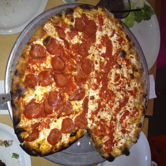 Photo taken at Tucci&#39;s Fire N Coal Pizza by Matthew M. on 2/14/2012
