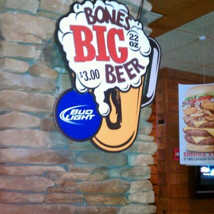 Photo taken at Smokey Bones Bar &amp; Fire Grill by Shannon D. on 1/4/2012