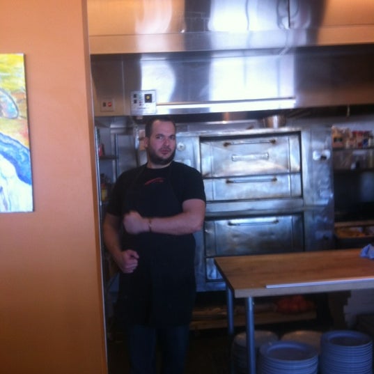 Photo taken at Gusto Pizza Co. by Mars Cafe on 12/9/2011