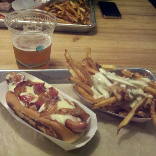 Photo taken at Bark Hot Dogs by Kadugen on 2/25/2012