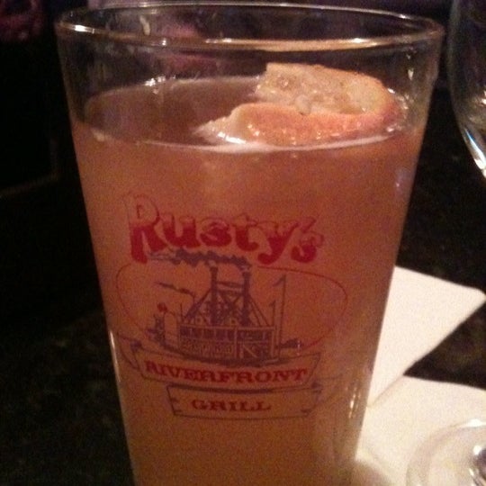Photo taken at Rusty&#39;s Riverfront Grill by Candis C. on 3/4/2012
