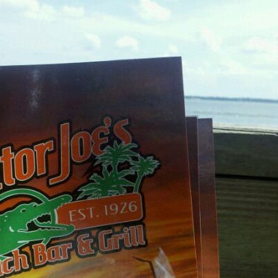 Photo taken at Gator Joe&#39;s Beach Bar &amp; Grill by Megan W. on 9/9/2011