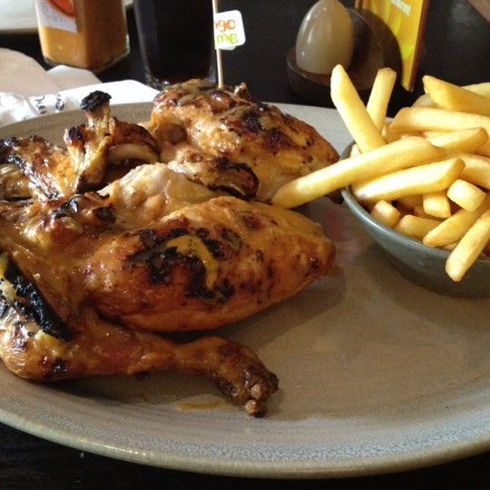 Photo taken at Nando&#39;s by Andrew Y. on 6/29/2012