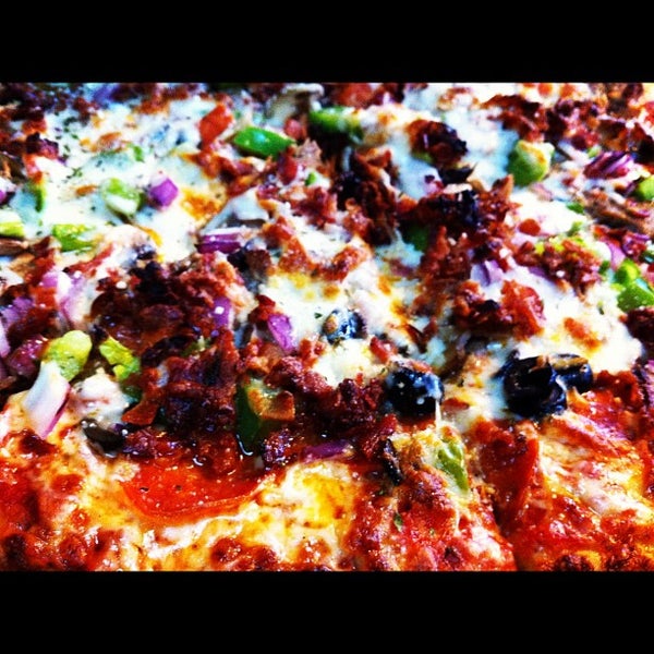 Photo taken at Solorzano Bros. Pizza by Carlos S. on 7/8/2012