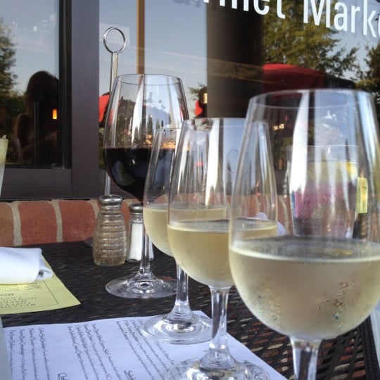 Photo taken at Poppyseed Market Café &amp; Wine Bar by John G. on 7/26/2012