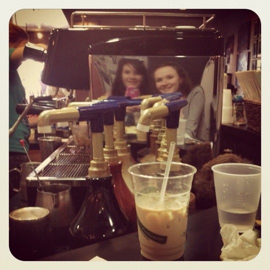 Photo taken at Village Coffee Roastery by Laura C. on 5/27/2012