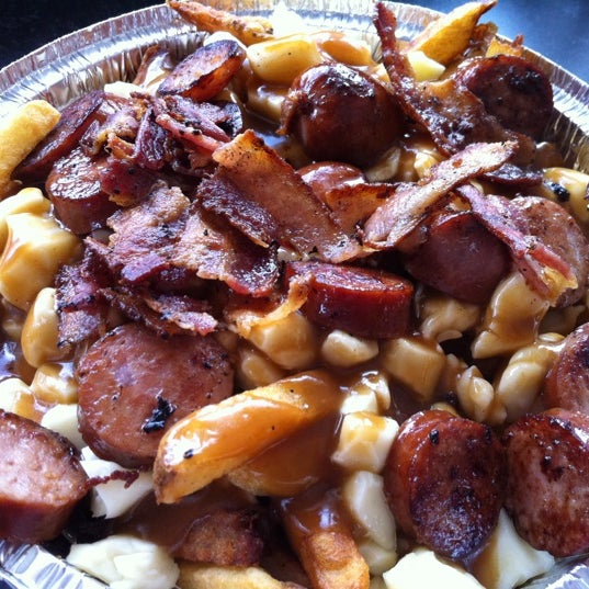 Photo taken at 514 Poutine by Aydin O. on 5/8/2012