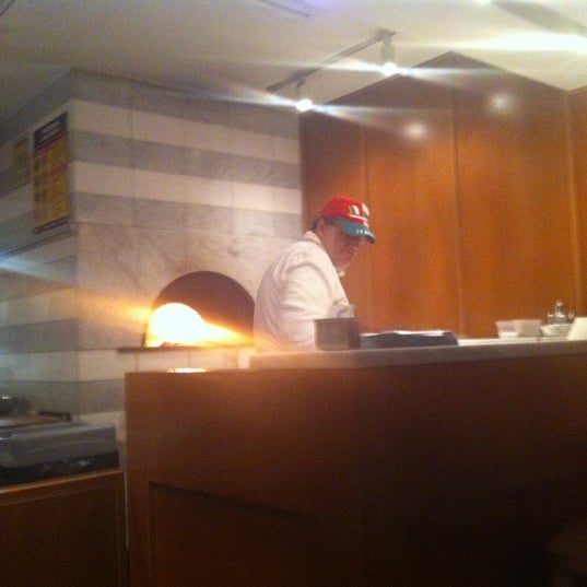 Photo taken at Pizza Mezzaluna by Elissa S. on 6/22/2012