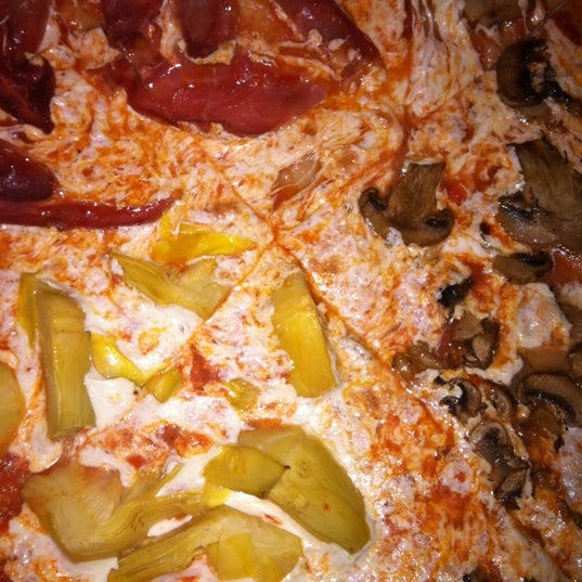 Photo taken at Vesuvio Pizzeria &amp; Restaurant by Lisette R. on 2/19/2012