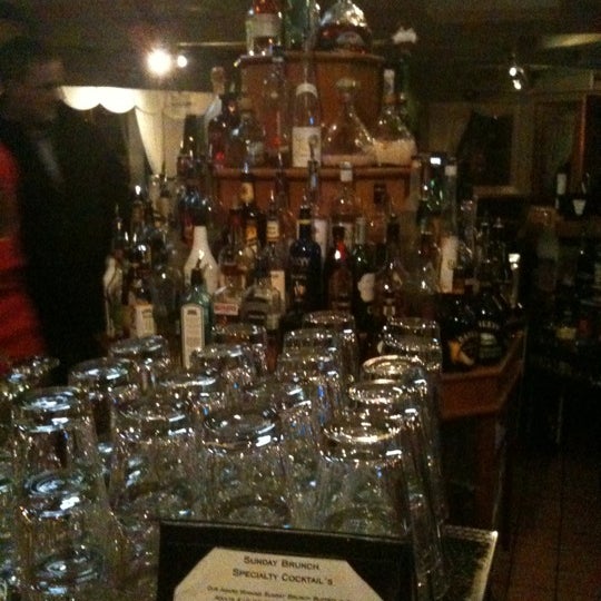 Photo taken at Atlantica Restaurant by Eileen C. on 11/13/2011
