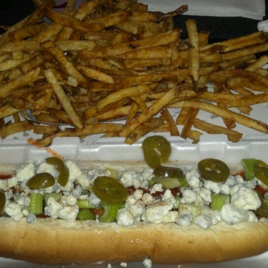 Photo taken at Scooter&#39;s World Famous Dawg House by Lisa M. on 4/3/2012