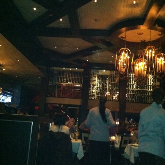 Photo taken at Insignia Prime Steak &amp; Sushi by Jeannette N. on 12/7/2011