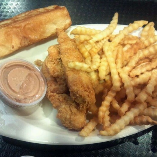 Photo taken at Raising Cane&#39;s Chicken Fingers by Jason C. on 2/25/2012