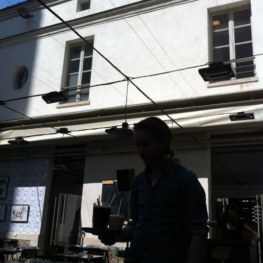 Photo taken at Café Caché by Richard V. on 5/27/2012