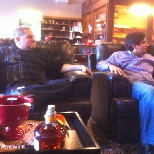 Photo taken at En Fuego Cigars &amp; Lounge by Michael G. on 4/27/2012