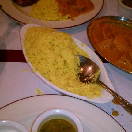 Photo taken at Darbar Indian Cuisine by Regine N. on 12/4/2011