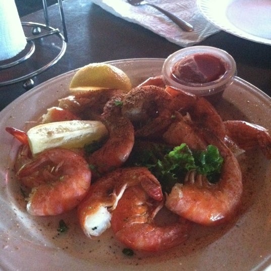 Photo taken at Bum Rogers Crab House &amp; Tavern by Kathy L. on 9/9/2011